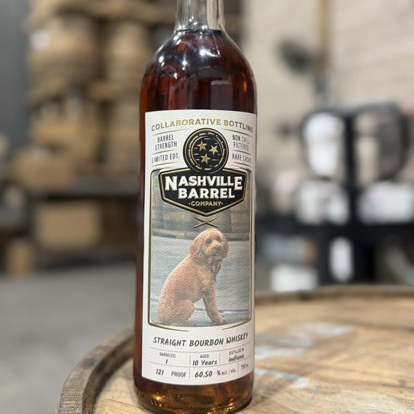 Custom label bottle — a real photo (Stella) printed on a Nashville Barrel Co Collaborative Bottling label